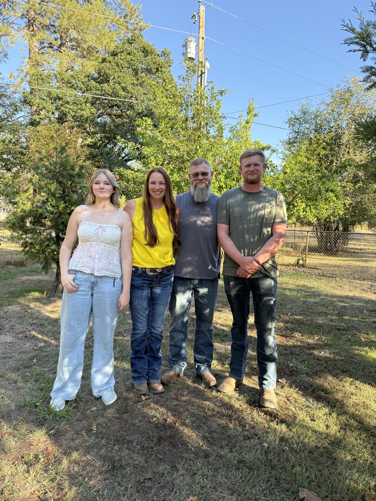 Larissa Mayfield with her family outdoors in rural Oregon
